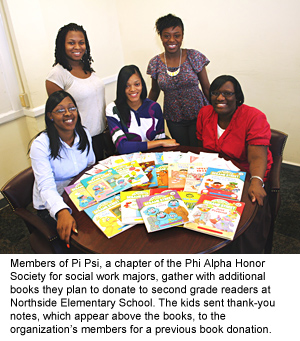 Social Work honors students donate books