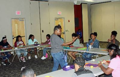Dr. Jametta Davis talks to girls at Camp Empower. 